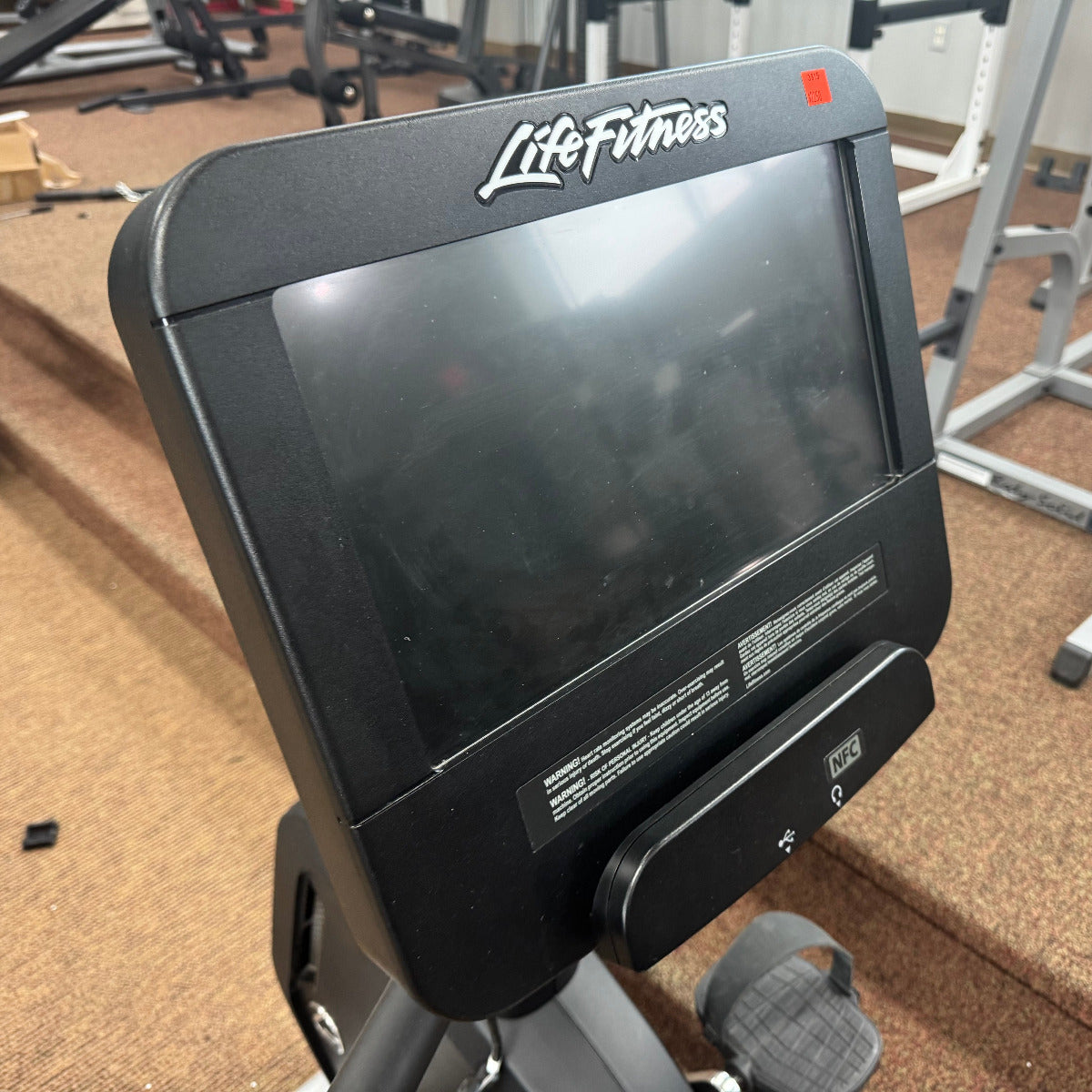 Life Fitness treadmill display panel in a gym setting