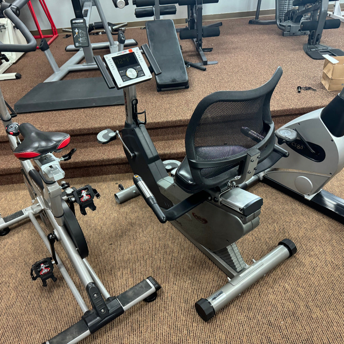 Exercise bike and recumbent bike in a gym setting