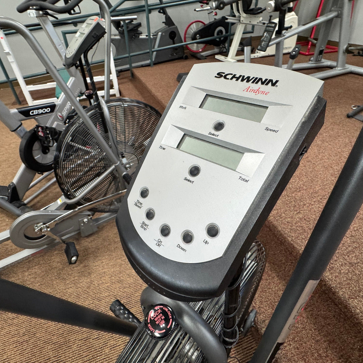 Close-up of a Schwinn exercise bike console in a gym setting